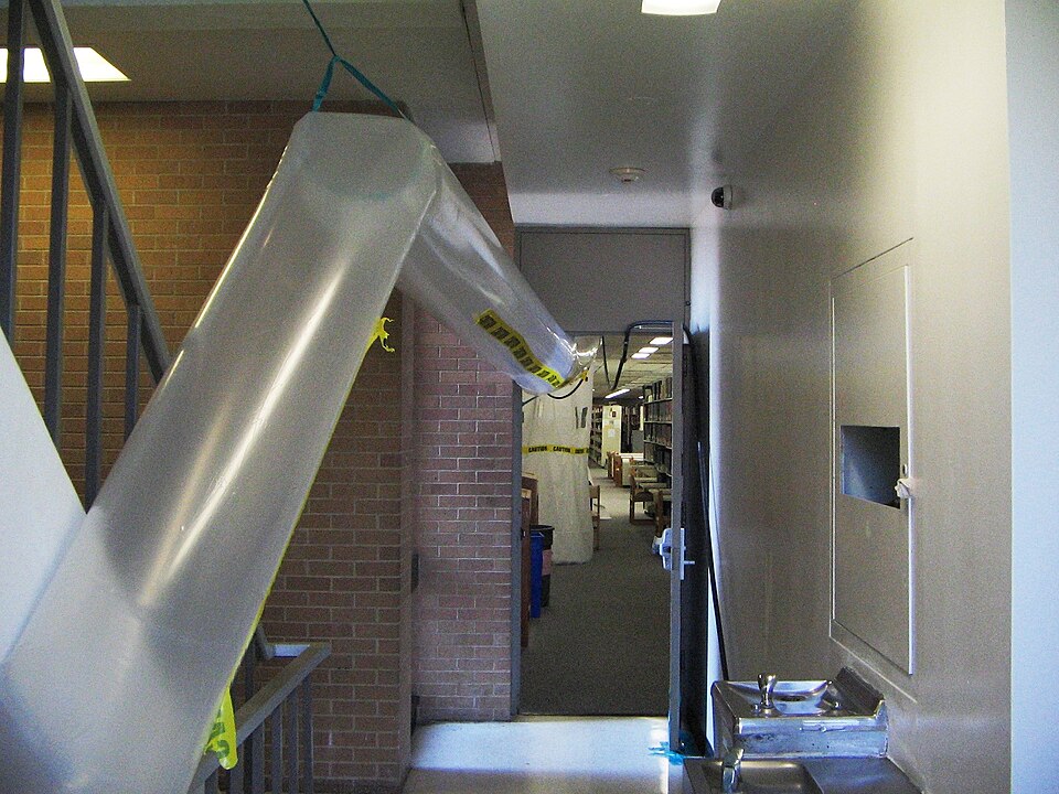 Containment set up with negative-pressure air ducting during asbestos work